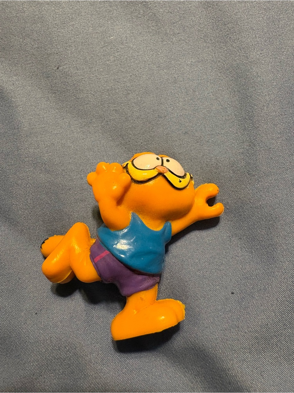 Garfield Figure in Blue Shirt and Purple Shorts